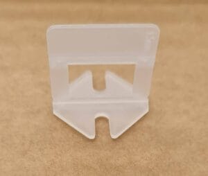 Plastic razor blade scraper for paint and debris removal, ideal for home improvement and construction projects, durable and easy to handle for precise scraping.