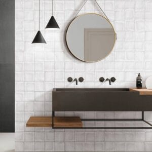 Tile Samples 31 Modern minimalist bathroom sink vanity with black fixtures, round mirror, and pendant lighting, featuring sleek design and contemporary decor, ideal for home renovation and bathroom upgrades.