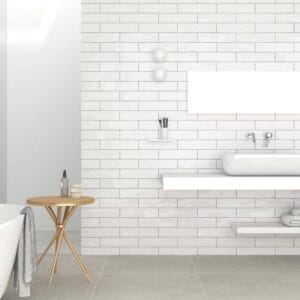 Modern bathroom interior with white subway tiles, minimalist sink, and stylish decor, perfect for home renovation projects.