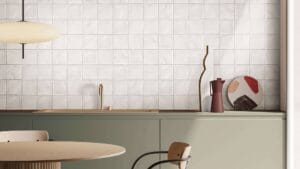 Sleek contemporary kitchen interior with minimalist design, featuring modern cabinetry, patterned decorative items, and a clean aesthetic for stylish home renovation.