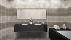 Sleek black bathroom vanity with dual sinks, modern fixtures, and minimalist decor in a neutral-toned tiled bathroom.