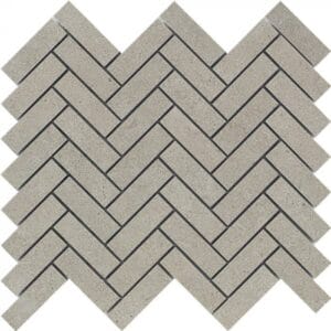 Grey herringbone brick paving pattern for outdoor landscaping and walkway designs, made from durable concrete materials. Ideal for patios, driveways, and garden pathways.