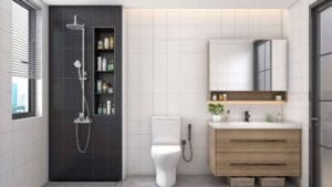 Modern bathroom with black and white tiles, open shower shelf, toilet, sleek wooden vanity, and large mirror, featuring contemporary fixtures and decor for stylish functionality.