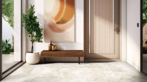 Modern entryway with sliding glass doors, wooden accents, potted plant, and contemporary artwork, creating a stylish and inviting home entrance.