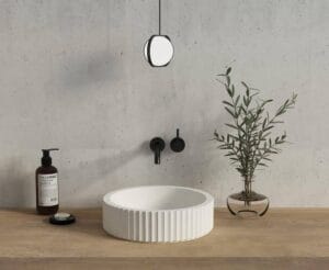 Sleek modern bathroom sink with black fixtures and minimalist decor, ideal for contemporary home renovation projects and bathroom upgrades.