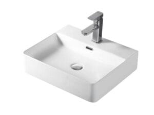 Porcelain bathroom sink with chrome faucet, modern kitchenware, white ceramic washbasin, durable bathroom fixture for renovation and building projects.