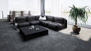 Stylish black leather sectional sofa in modern office lounge with large window and city view, perfect for contemporary home or commercial furniture settings.