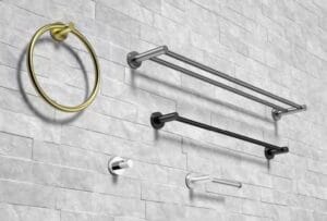 Modern bathroom towel racks and rings mounted on a textured gray wall, featuring brass, chrome, and black finishes for stylish and functional bathroom decor.