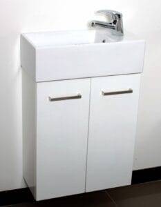 Shallow white bathroom vanity with a rectangular sink, chrome faucet, and modern silver handles on cabinet doors, ideal for small spaces or minimalist bathroom designs.