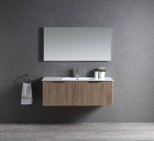 Contemporary bathroom vanity with a sleek white countertop, minimalist faucet, and modern wooden cabinet with ribbed design, complemented by wall-mounted mirror and decorative accessories.