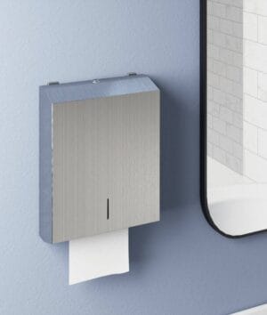 Toilet paper dispenser mounted on a wall in a modern bathroom, featuring stainless steel design and durable construction, ideal for bathroom hardware and accessories from Builders Warehouse Online.