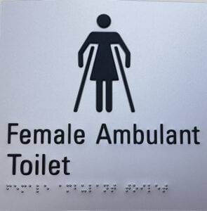 Accessible Female Ambulant Toilet sign for public facilities, featuring tactile Braille for visually impaired individuals, emphasizing inclusive building and construction standards.