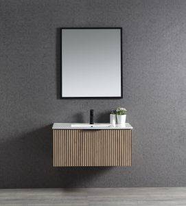 Contemporary bathroom vanity with a floating wooden cabinet, white countertop, and black faucet against a textured gray wall. Includes a mirror and decorative plant for modern home decor.