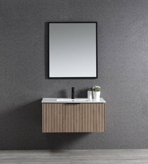 Contemporary bathroom vanity with a floating wooden cabinet, white countertop, and black faucet against a textured gray wall. Includes a mirror and decorative plant for modern home decor.