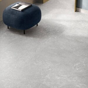 Sleek grey stone-look flooring with a modern interior design, perfect for renovation projects and commercial spaces.