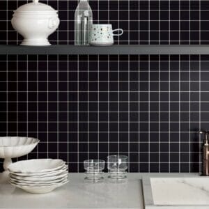 Tile Samples 39 Modern black and white tiled kitchen backsplash with stylish white dishware and glassware, perfect for renovation and upgrade projects.