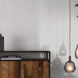 Tile Samples 36 Concrete textured wall with white circular tiles, modern black shelving, and hanging pendant light, ideal for interior design, bathroom, or kitchen renovation.