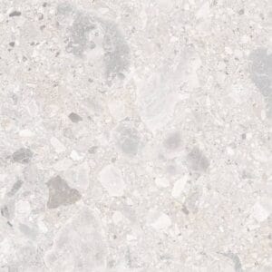 Light grey terrazzo flooring with mixed stone chips and smooth surface, ideal for modern interior design and durable flooring applications.
