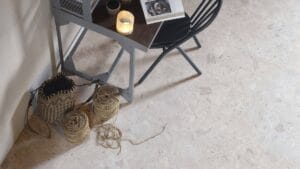 Soft beige marble flooring with textured natural stone appearance, ideal for home renovation projects, durable and stylish for indoor spaces.