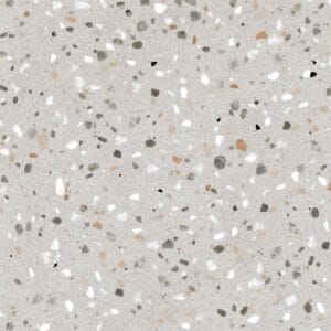 White and beige terrazzo concrete surface with multicolored aggregate chips for flooring and decorative applications.