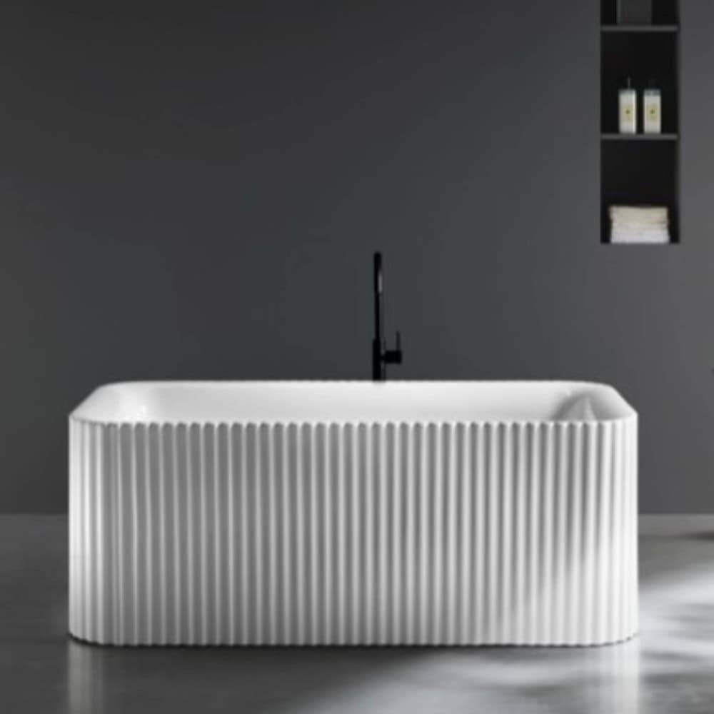 Luxurious freestanding bathtub with ribbed exterior in a modern bathroom setting, featuring sleek black faucet and minimalist design. Perfect for contemporary home renovation projects.
