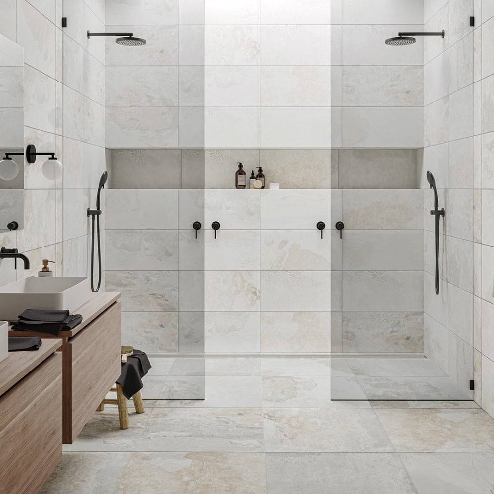 Contemporary walk-in shower with dual rainfall showerheads, black fixtures, and minimalist tiles in a modern bathroom setting. Ideal for stylish and functional bathroom renovations.