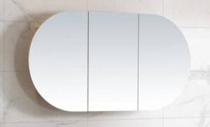 Benefits of a Mirror Cabinet – Style Meets Function 4 Modern oval wall mirror with sleek white frame, ideal for bathroom or bedroom decor, perfect for a contemporary home renovation.
