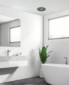 Modern bathroom with minimalist design, white bathtub, vanity, and large windows, showcasing contemporary bathroom fixtures and natural lighting.
