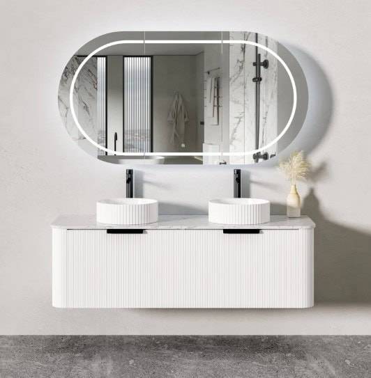 Modern double vanity bathroom sink with large illuminated mirror, sleek white countertop, and stylish decor, perfect for contemporary home renovation projects.