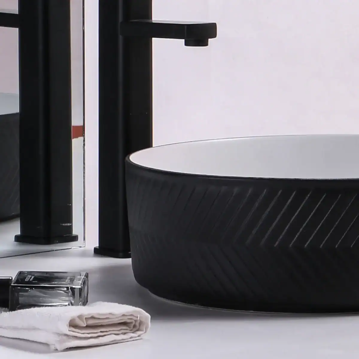 Modern basin styles in a contemporary bathroom setting – above-counter and wall hung basins